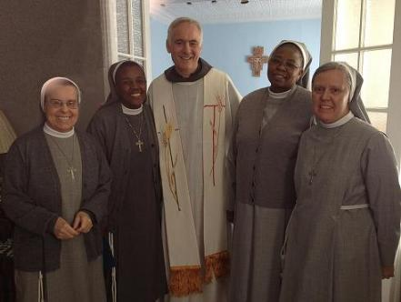 Trinity Sisters with Fr. Timothy